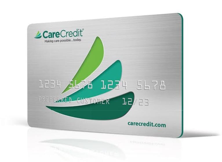 CareCredit healthcare credit card with green leaf design.