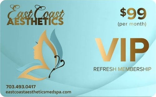 Business card for East Coast Aesthetics with spa details.